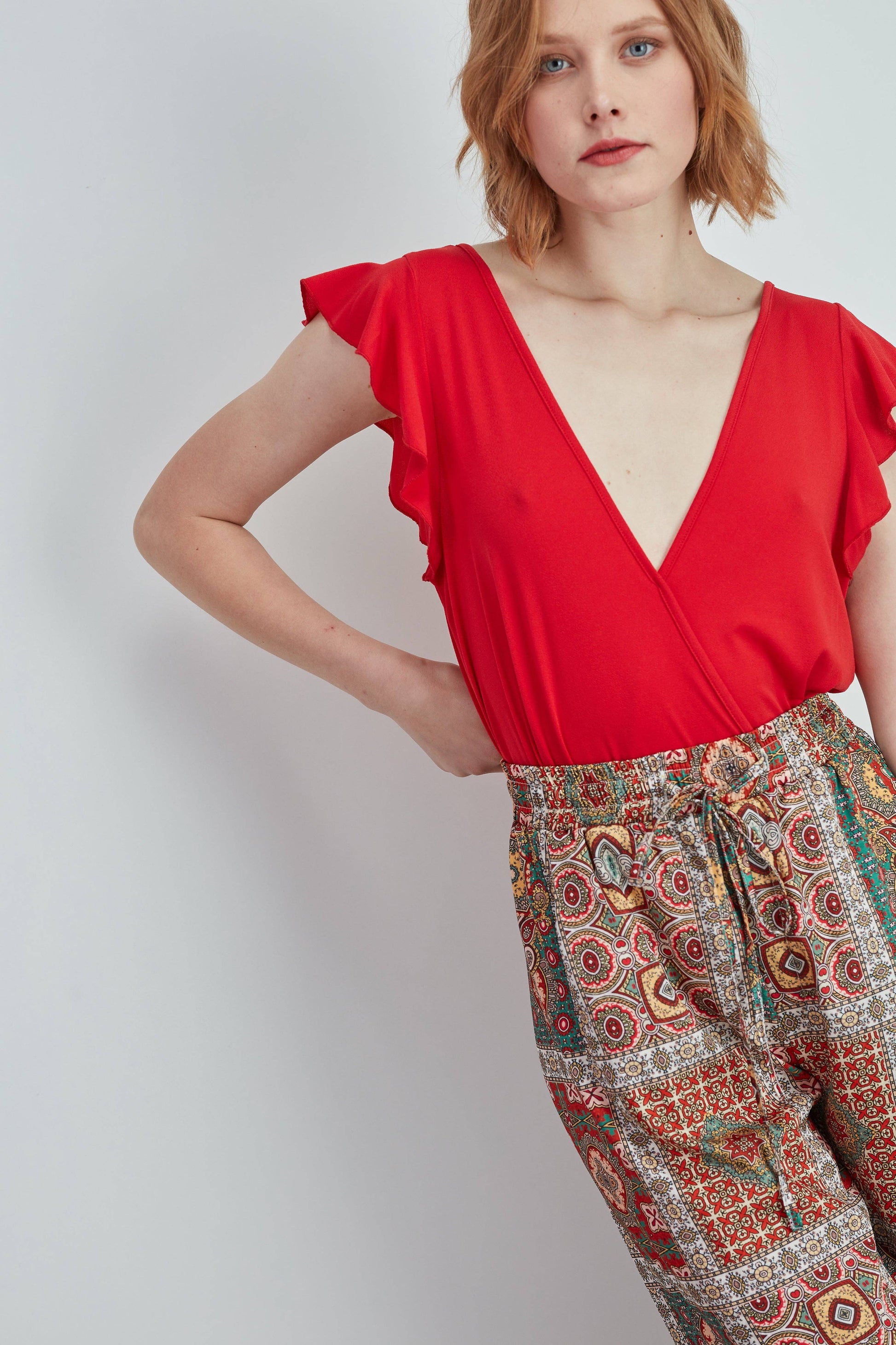 Body GUIMANOS con scollo a V in rete