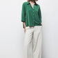 Blusa oversize verde con colletto classico