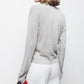 Maglione a maglia rasata con dettagli metallici