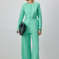 Completo in crepe verde menta con tunica plissettata e pantaloni a gamba larga