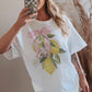T-shirt oversize limone con fiocco rosa