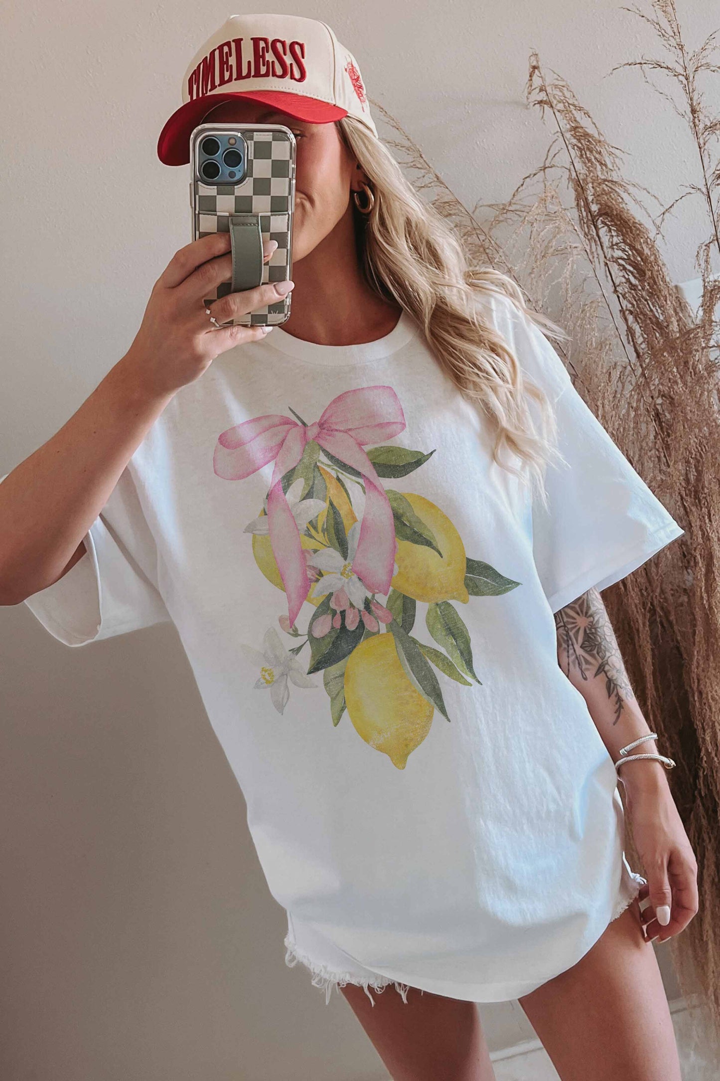 T-shirt oversize limone con fiocco rosa