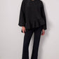 Blusa nera con balza asimmetrica