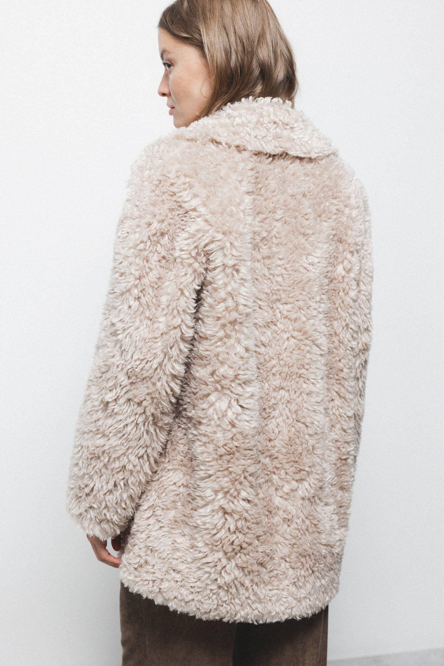 Cappotto teddy in pelliccia sintetica beige