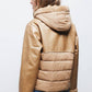 Giacca in ecopelle con cappuccio e zip
