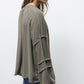 Blusa con pieghe e maniche arricciate