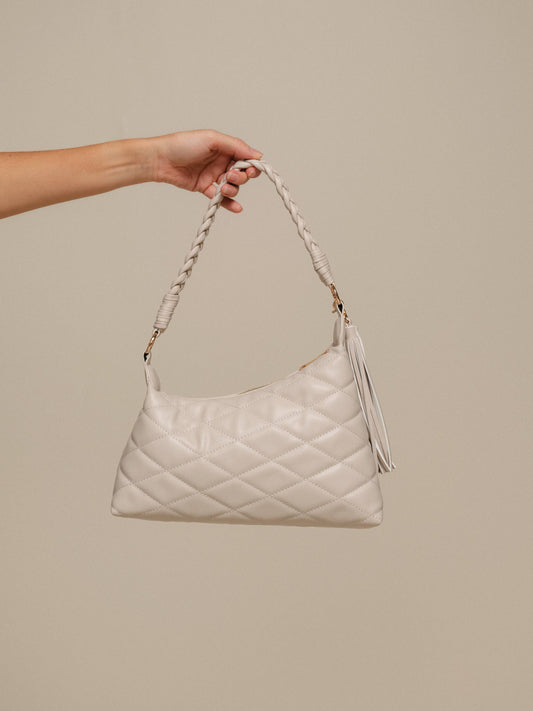 Borsa a spalla trapuntata in PU con manico intrecciato e nappina