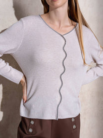 Maglione in maglia scintillante con profilo ondulato