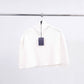 Poncho maglione in maglia a coste con collo alto