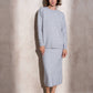 Completo in maglia scintillante due pezzi con gonna midi