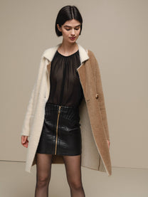 Cappotto bicolore effetto bouclé cammello e panna