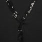 Blusa nera con paillettes e scollo a V