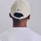 Cappellino beige con ricamo “Overthinking”