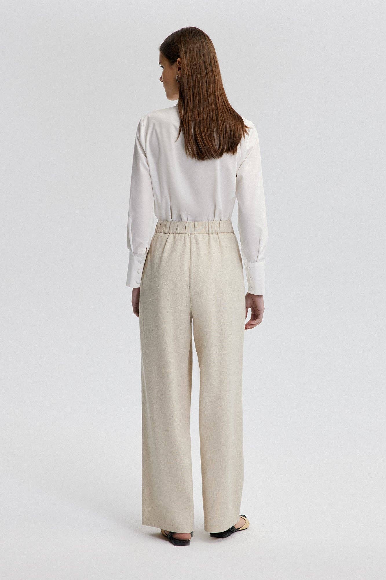 Pantaloni sartoriali in lino crema a gamba larga