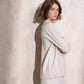 Completo in maglia scintillante due pezzi con gonna midi