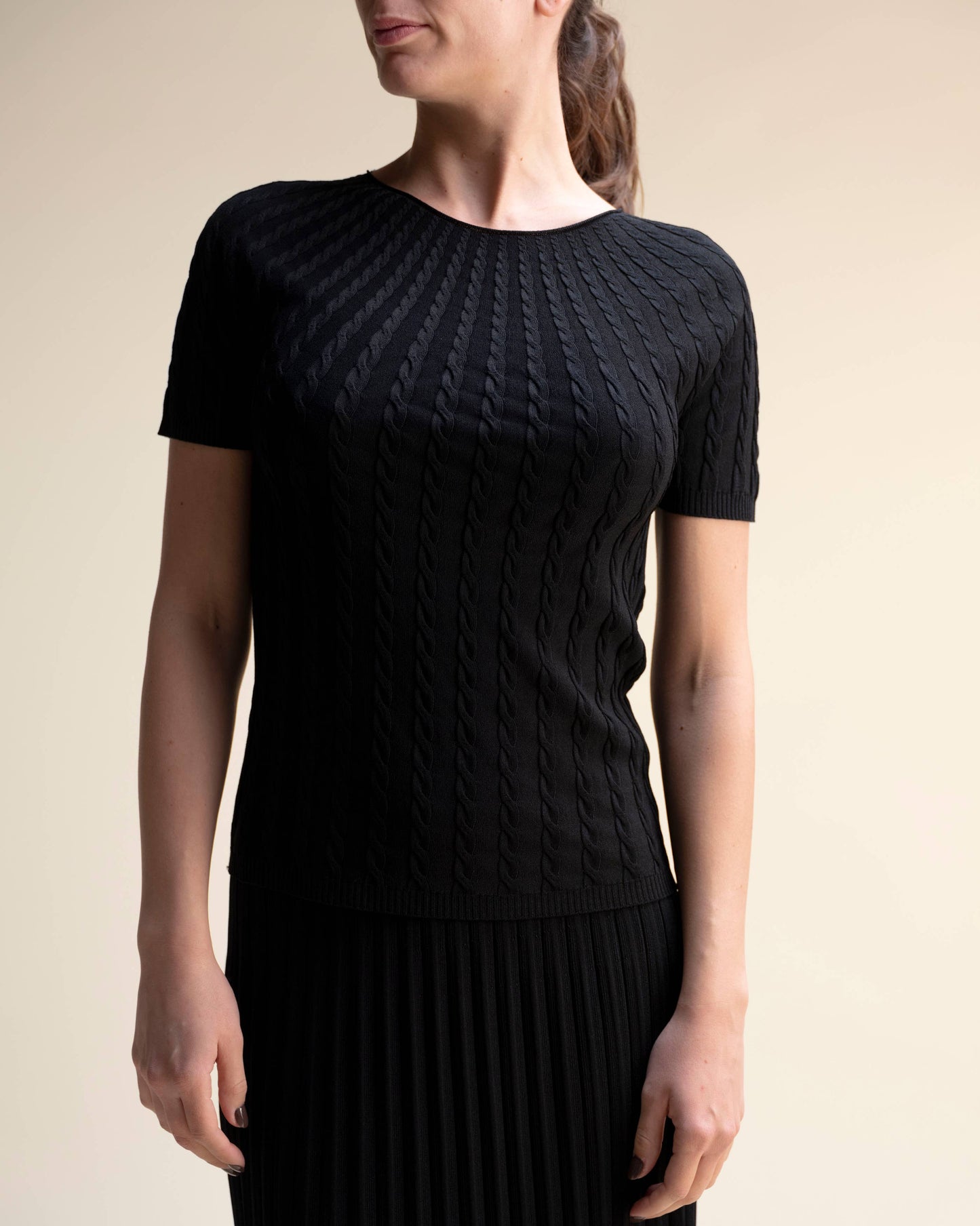 Top in maglia a trecce a maniche corte