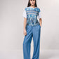 T-shirt oversize corta con stampa e fiocco laterale