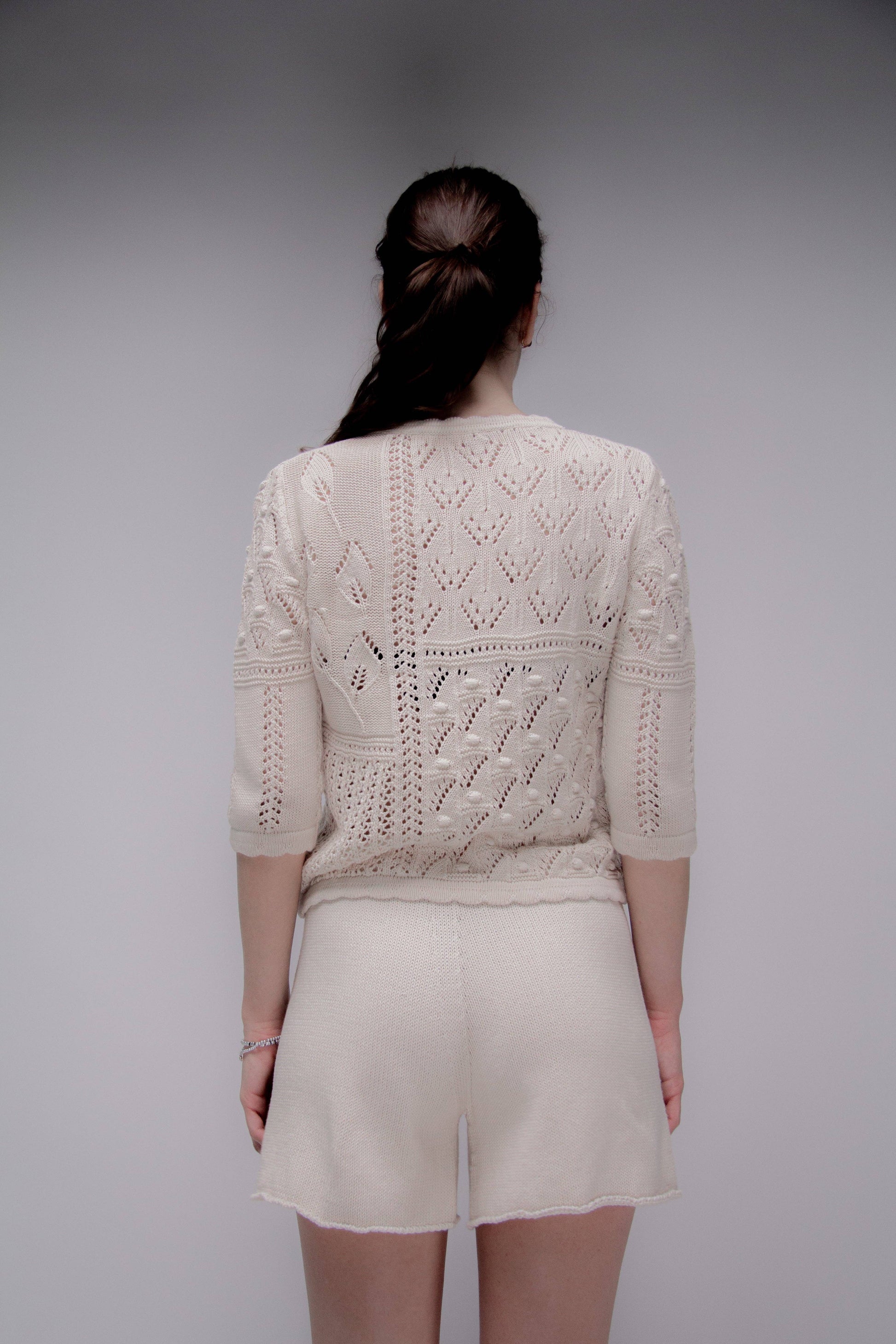 Maglia traforata in cotone con motivo floreale