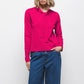 Maglione in maglia rasata con fiocco e scollo a V