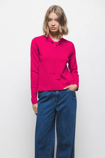 Maglione in maglia rasata con fiocco e scollo a V