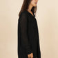 Abito corto in pizzo nero con scollo a V e volant