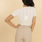 Top in maglia traforata con scollo a V Maki