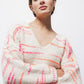 Maglione in maglia a righe con scollo a V