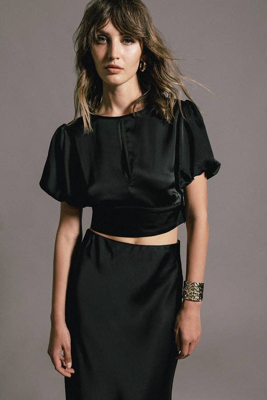 Top crop con maniche a palloncino e fiocco sul retro