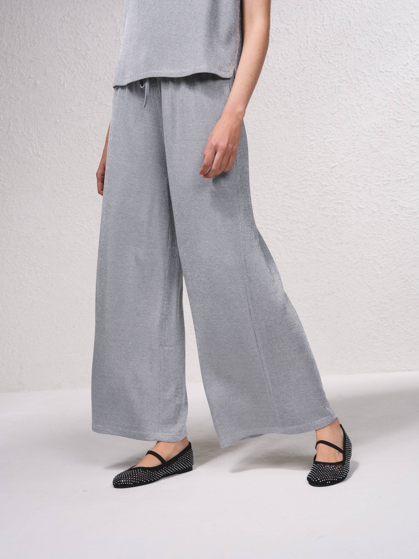 Pantaloni palazzo in lurex con coulisse