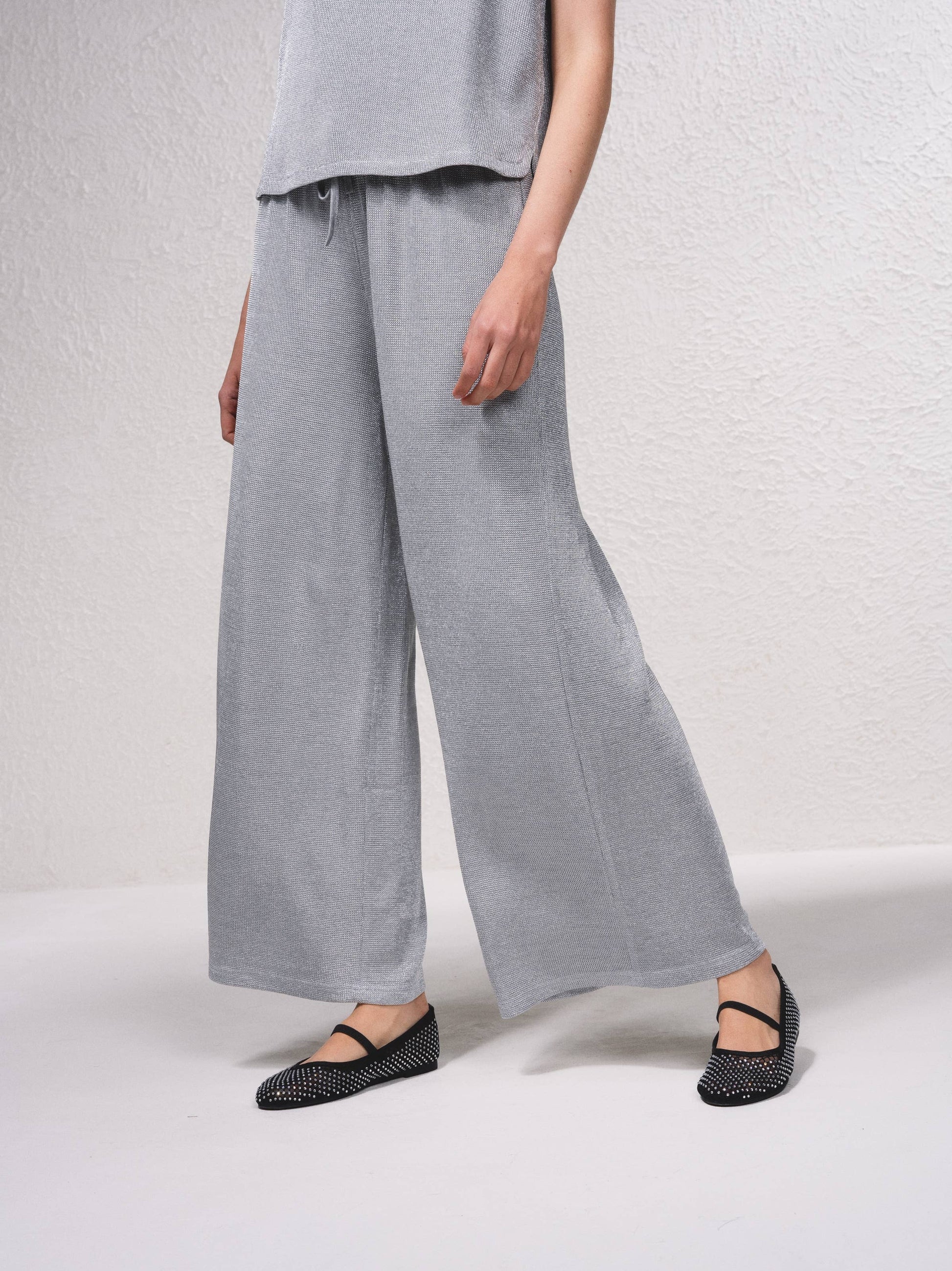 Pantaloni palazzo in lurex con coulisse