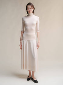 Dolcevita a coste in lana merino extrafine con manica 3/4
