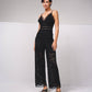 Tuta intera in pizzo con scollo a V e spalline incrociate