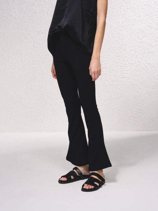Pantaloni a zampa in rete con vita elasticizzata