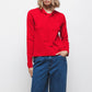 Maglione in maglia rasata con scollo a V e fiocco