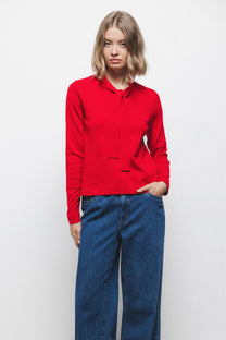 Maglione in maglia rasata con scollo a V e fiocco
