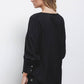 Blusa nera con paillettes e scollo a V
