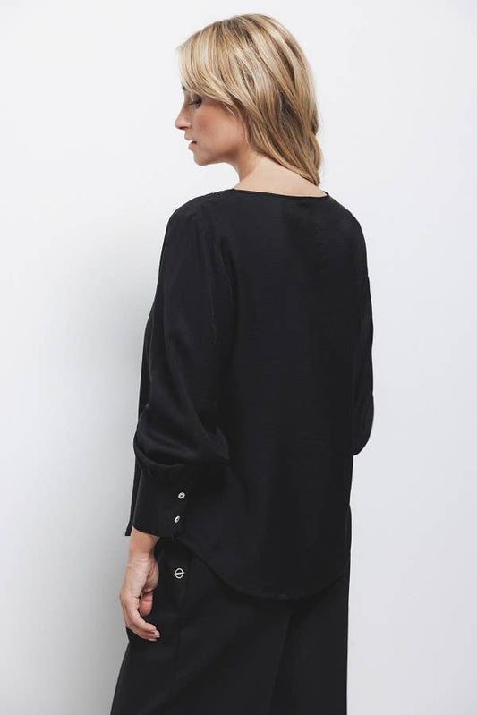 Blusa nera con paillettes e scollo a V