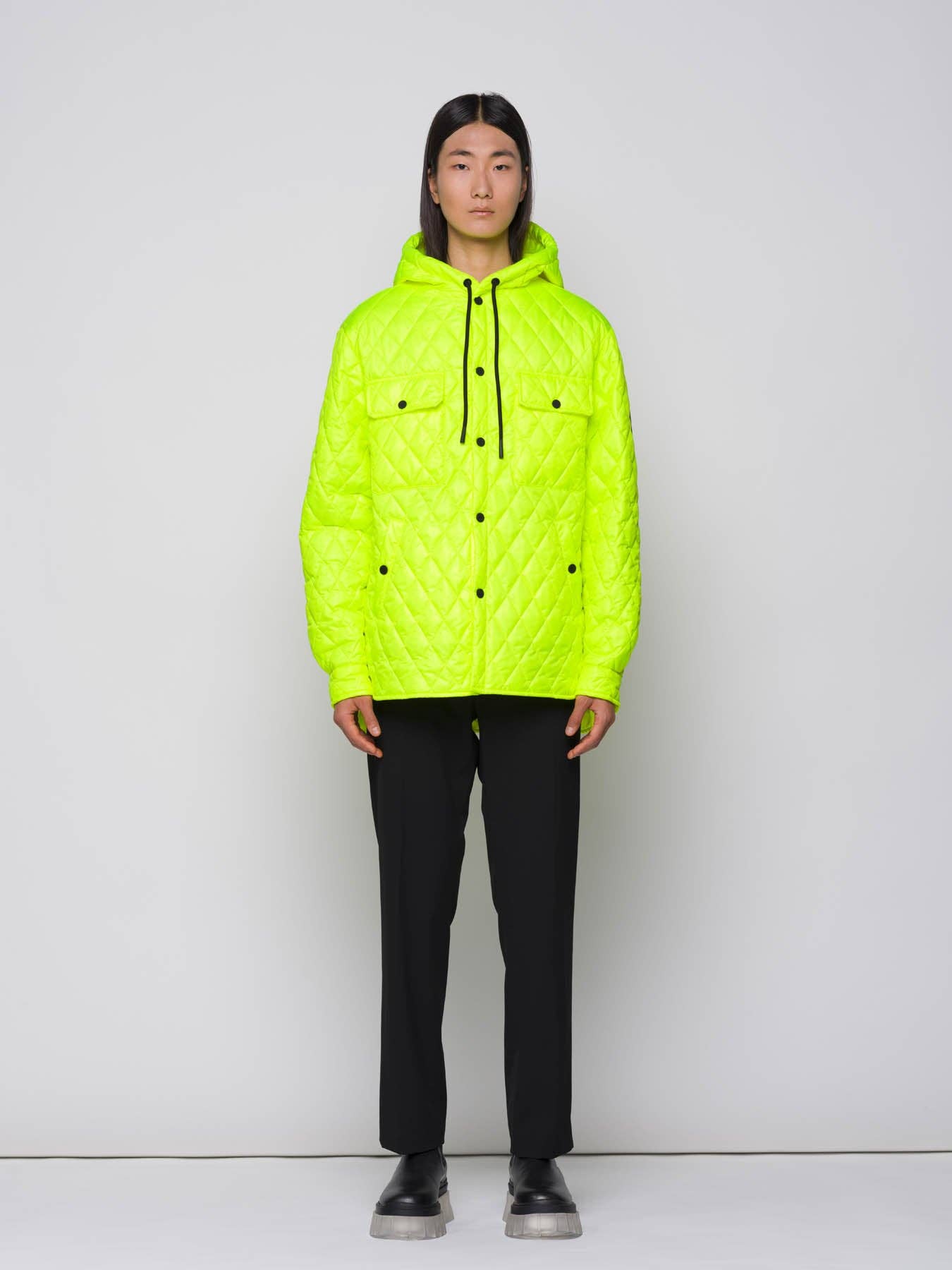 Giacca trapuntata a rombi con cappuccio fluo