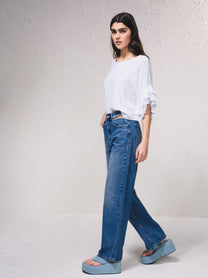 Jeans a vita alta wide leg con strass e strappi