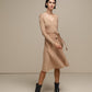 Abito midi in maglia lurex con gonna plissé e cintura