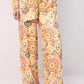 Completo boho con camicia stampata e pantaloni palazzo
