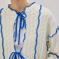 Cardigan in maglia con laccetti e profili a contrasto