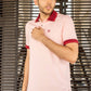 Polo antimacchia rosa con collo a contrasto
