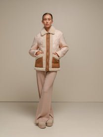 Giacca trapuntata bicolor con profili teddy e zip