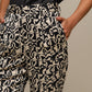 Pantaloni a fantasia geometriche effetto perlato