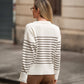 Maglione a righe con bottoni decorativi