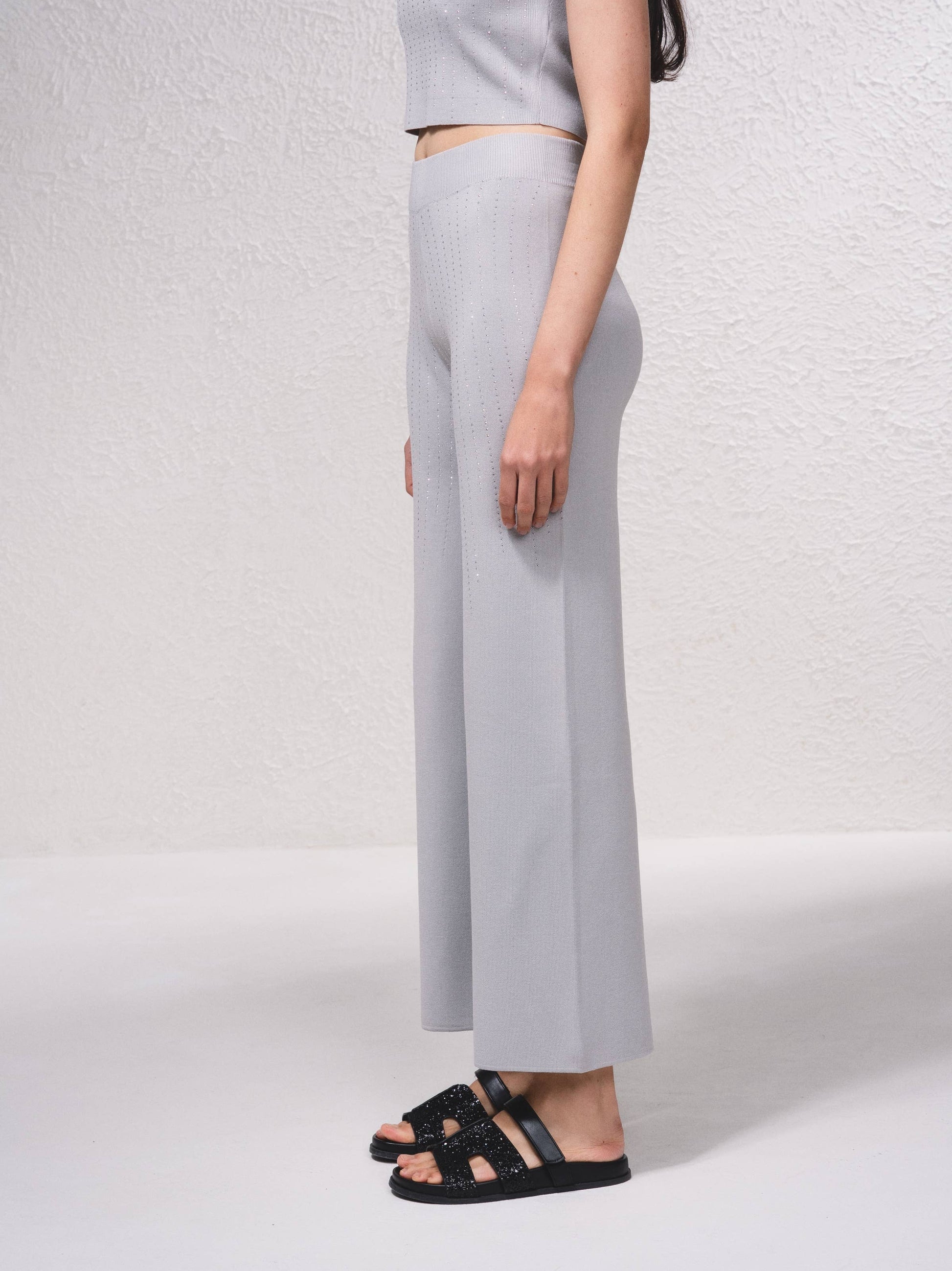 Pantaloni in maglia a gamba ampia con applicazioni glitter