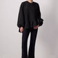 Blusa nera con balza asimmetrica