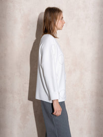 Maglione in maglia con motivo a pois e bottoni ai polsi