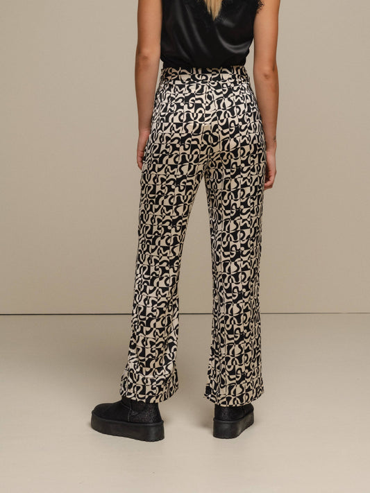Pantaloni a fantasia geometriche effetto perlato